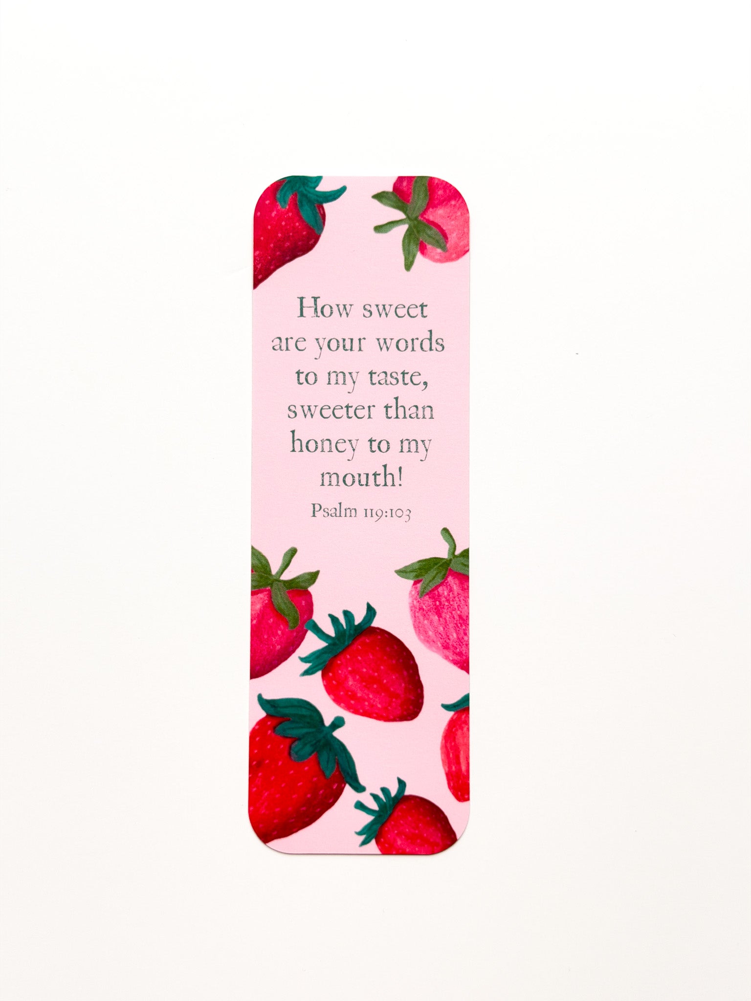Bookmark with strawberry design and Bible verse on a pink background