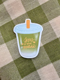 Jesus and Matcha sticker featuring a green cup design with orange text on a checkered background.